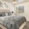 a bedroom with a bed and a fan